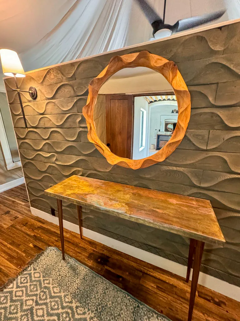 Sculpted wood mirror and console table in San Antonio