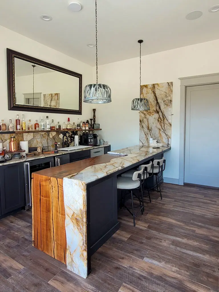 Custom live edge wood and marble waterfall bar countertop in San Antonio kitchen