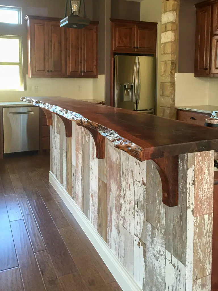Live edge slab bar top on reclaimed wood island in San Antonio