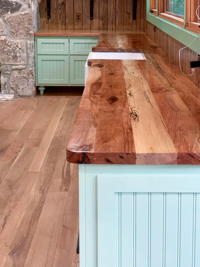 Custom butcher block style countertop on farmhouse kitchen island