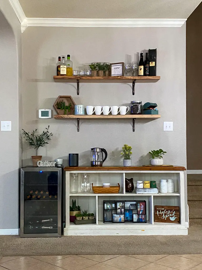 Reclaimed wood floating shelves above farmhouse coffee bar station