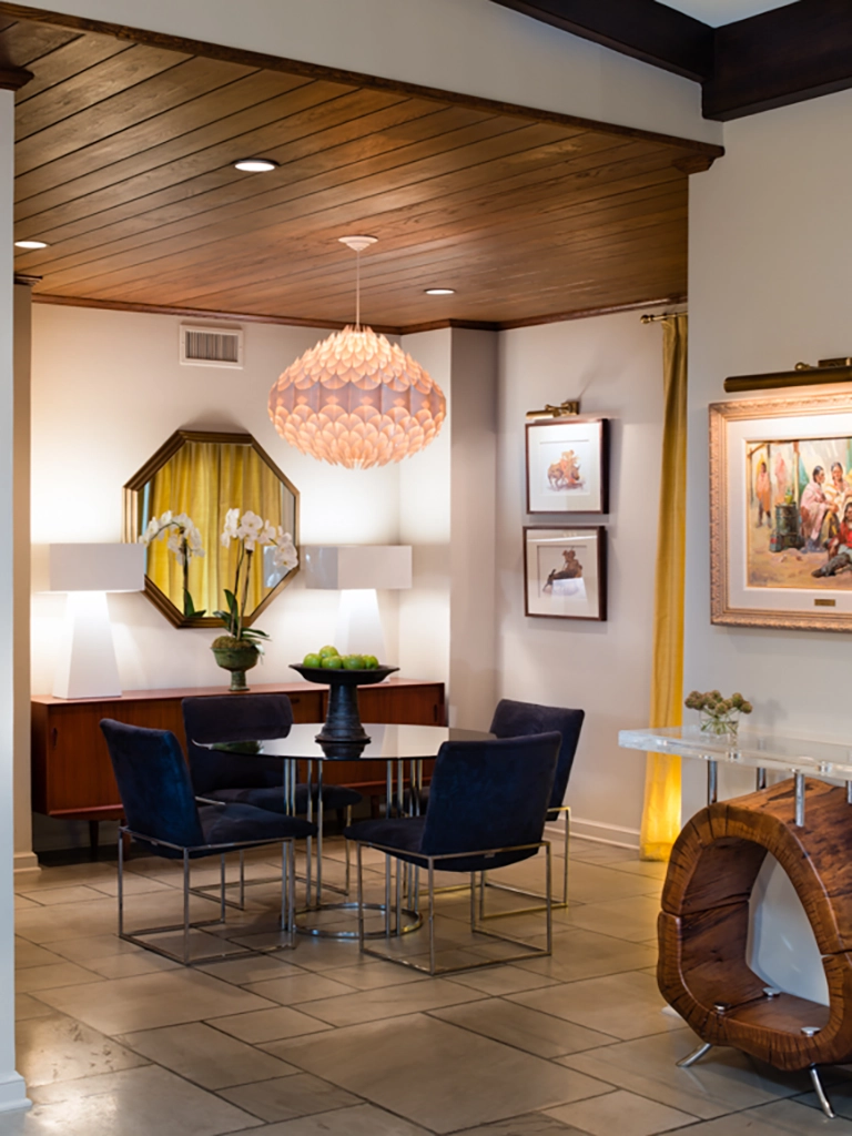 Elegant entry furniture with wood ceiling and custom wood accent piece
