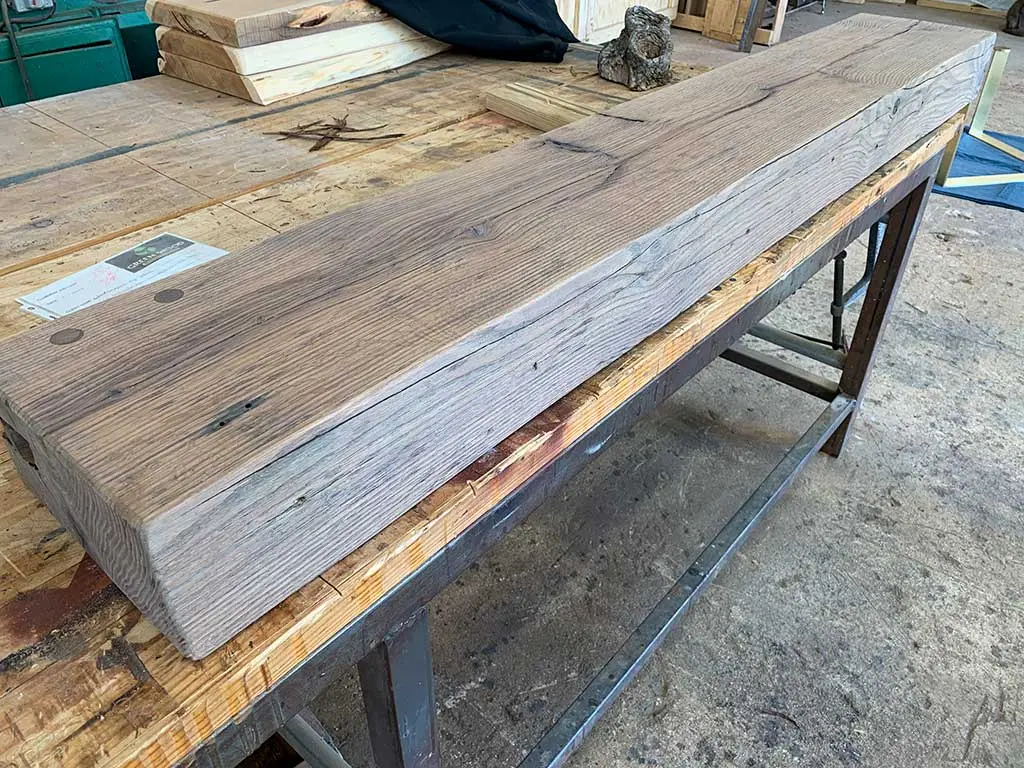 Reclaimed wood beam mantle handcrafted by Green Wood Milling Co. in San Antonio