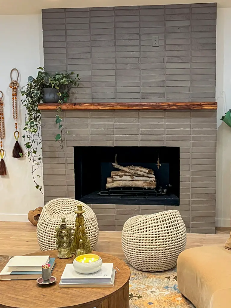 Live edge fireplace mantle on brick surround by Green Wood Milling Co.