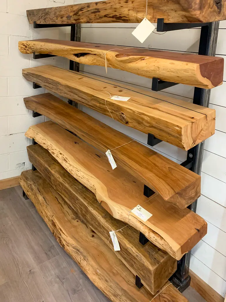 Live edge mantles on display rack at Green Wood Milling Co.