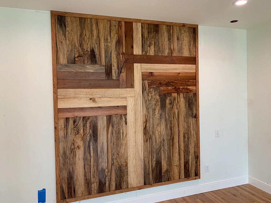 Wood with reclaimed distressed finish replicating salvaged materials