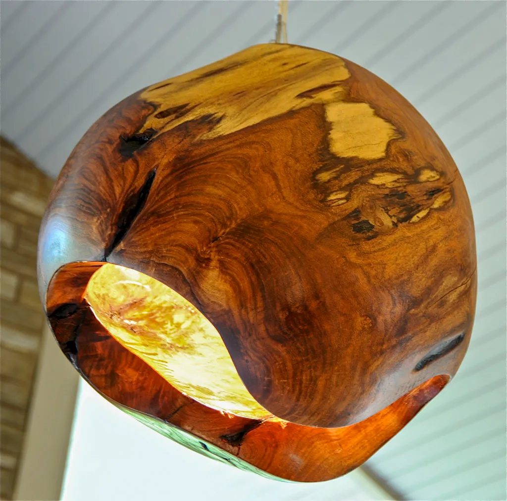 Custom carved wood pendant light fixture by Green Wood Milling Co.