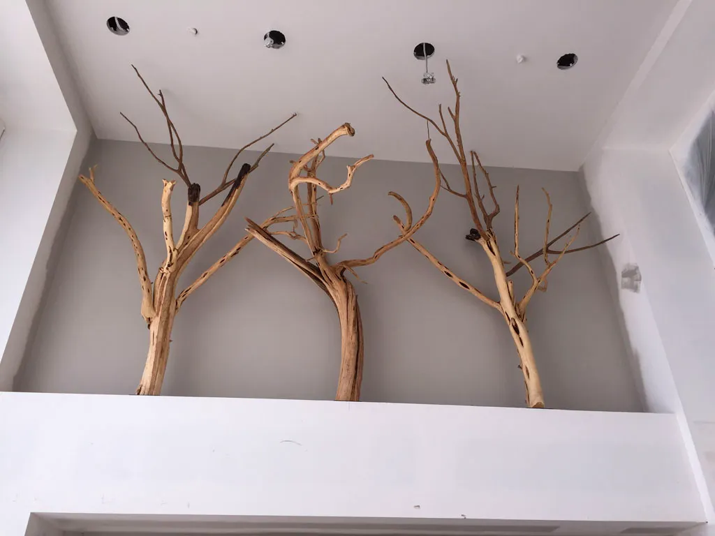 Decorative branch sculptures in alcove by Green Wood Milling Co.