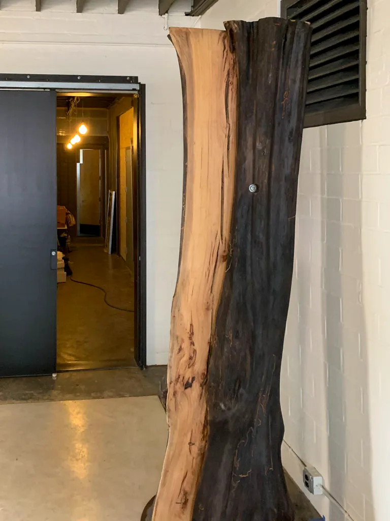Live edge wood slab sculpture in Green Wood Milling Co. workshop