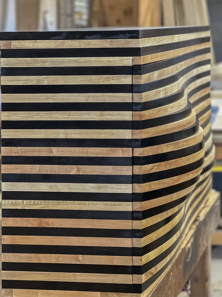 Striped wood and resin art piece by Green Wood Milling Co. San Antonio